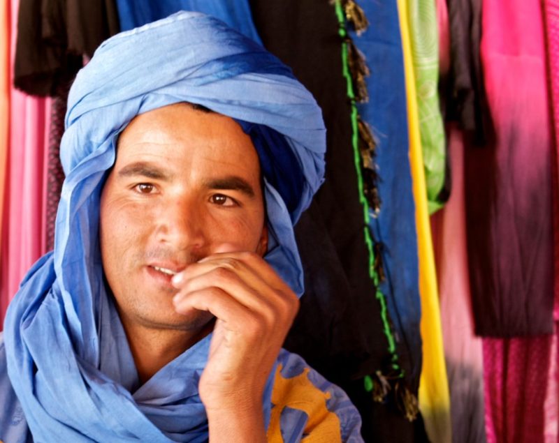 A man from an African unreached people group, sitting on a donkey.