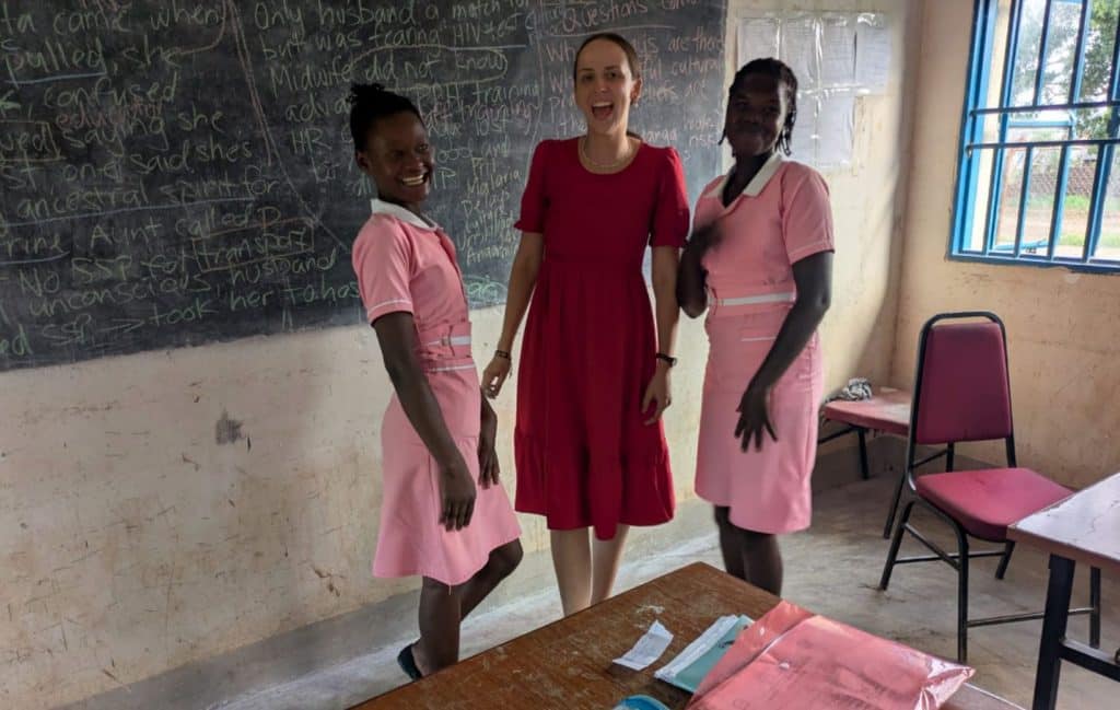 missionary and midwife Julia stands with two south sudanese midwifery students