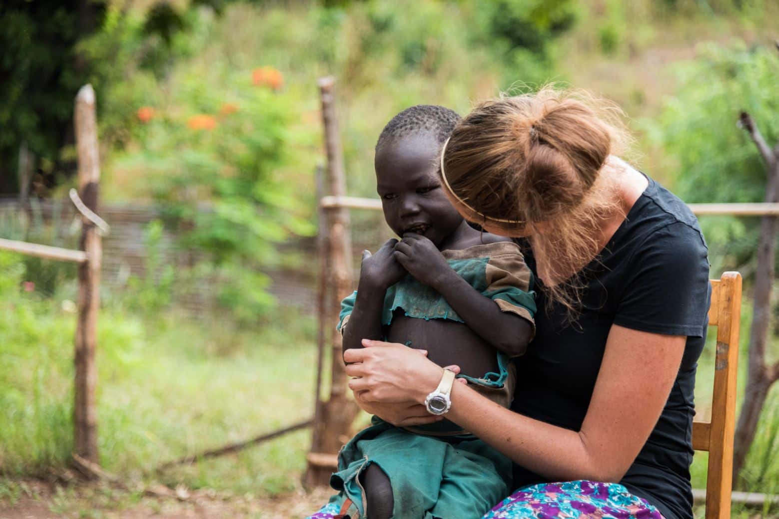 A mission worker holds a child in South Sudan