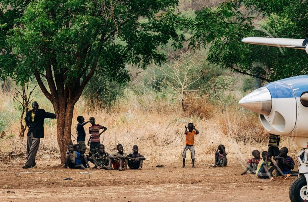 An AIM Air plane visiting Lopit villagers in South Sudan
