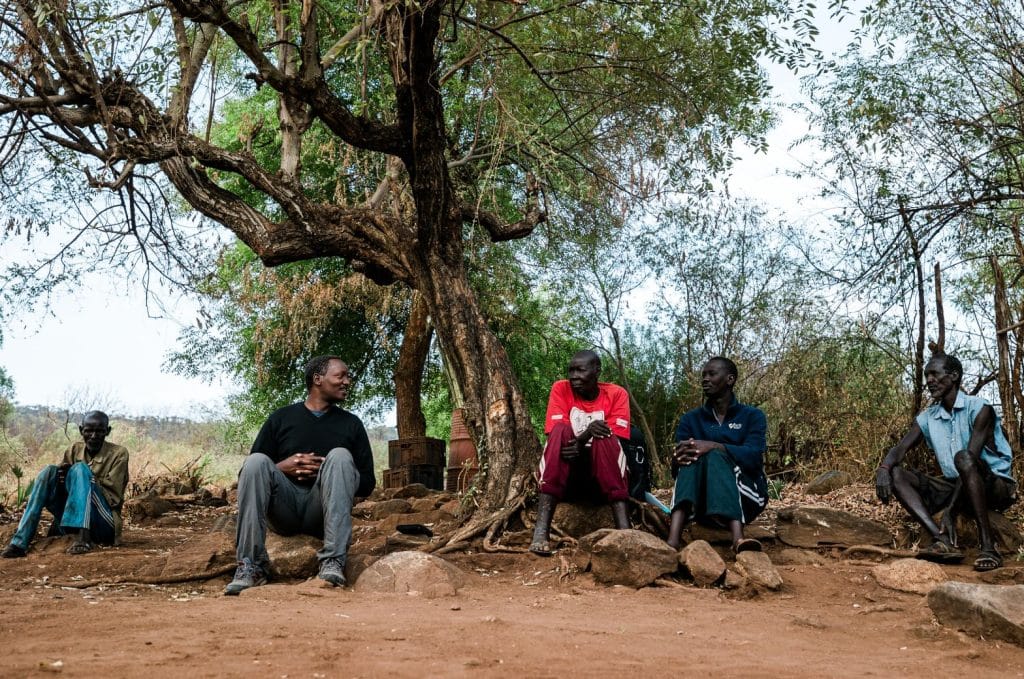 A Bible study outdoors among the Lopit people